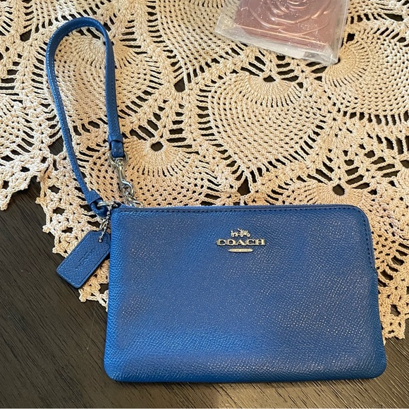 Coach Handbags - Coach Corner Zip Wristlet in a blue color